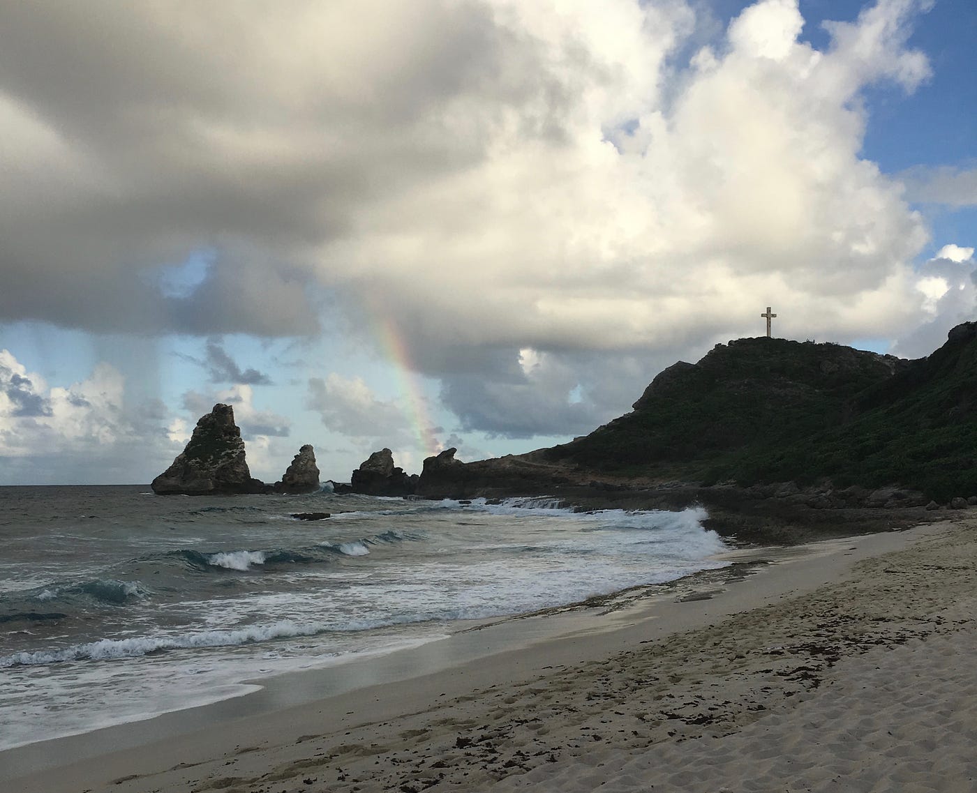 Moments after this rainbow photo was taken at Pointe des Châteux, the sky opened up and the whole family was soaked. The rainbow should’ve been a clue.