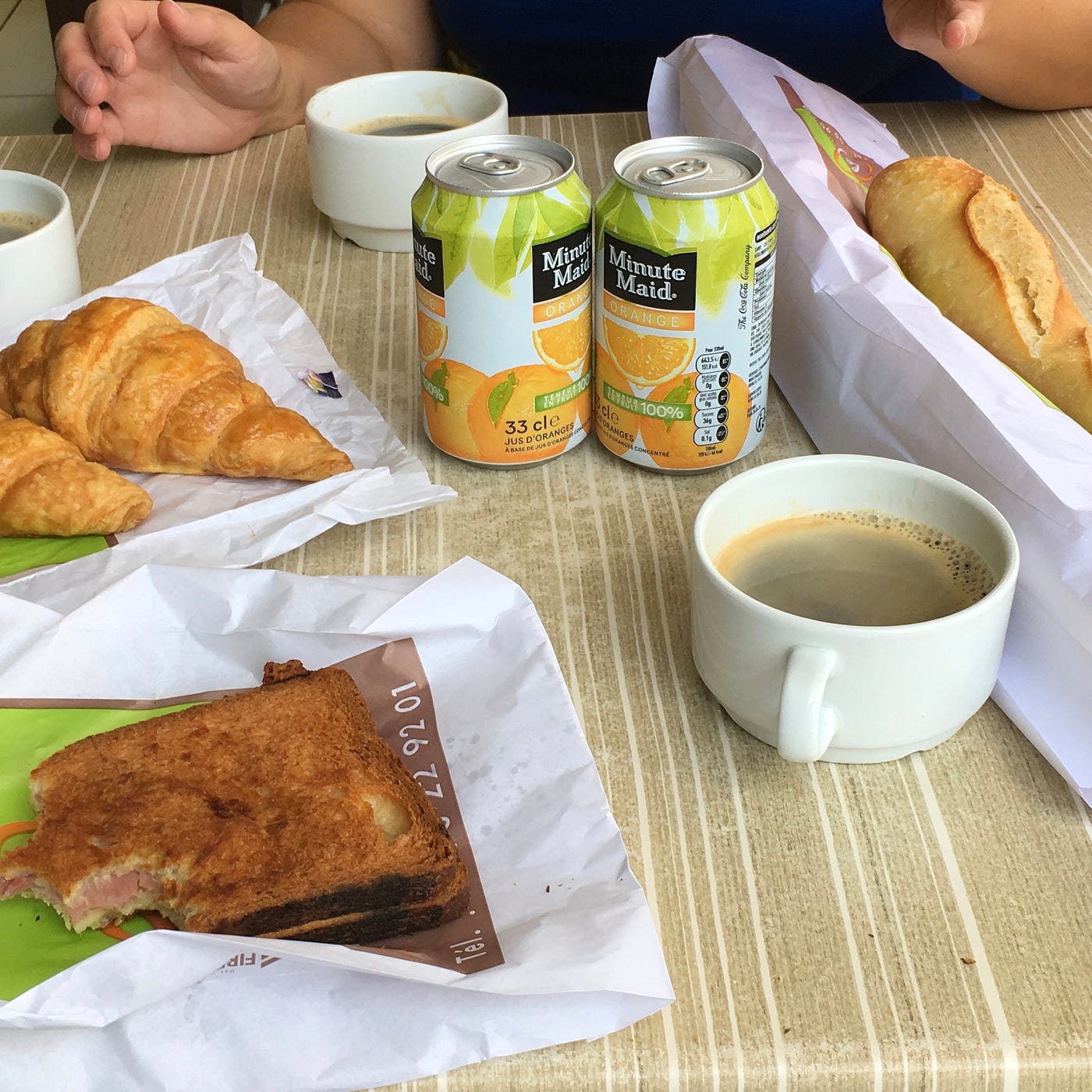 Breakfast with coffee, baguettes, and croissants Smoking