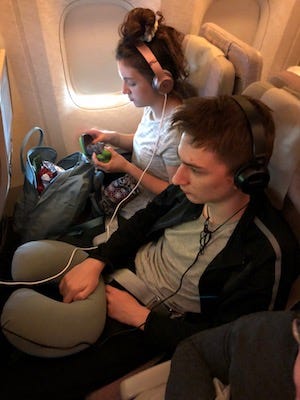 The kids settle in for 20 hours of flight time.